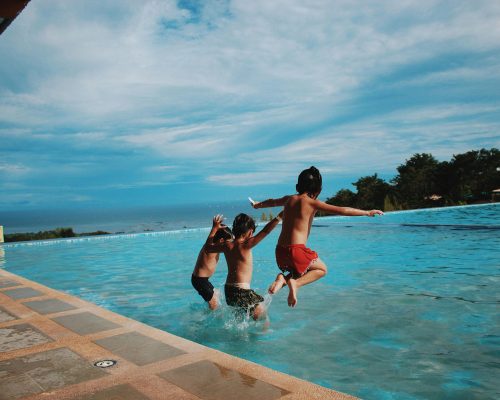 Three Boy's Jumping Into the Water